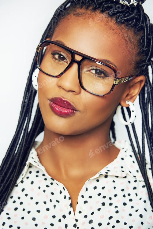 Preview: Pretty young African woman pouting at the camera