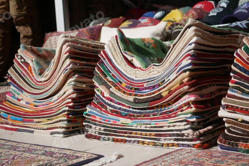 Preview: Vibrant collection of handmade rugs displayed for sale