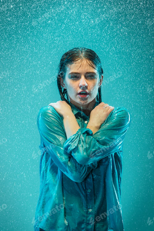 Preview: The portrait of young beautiful woman in the rain