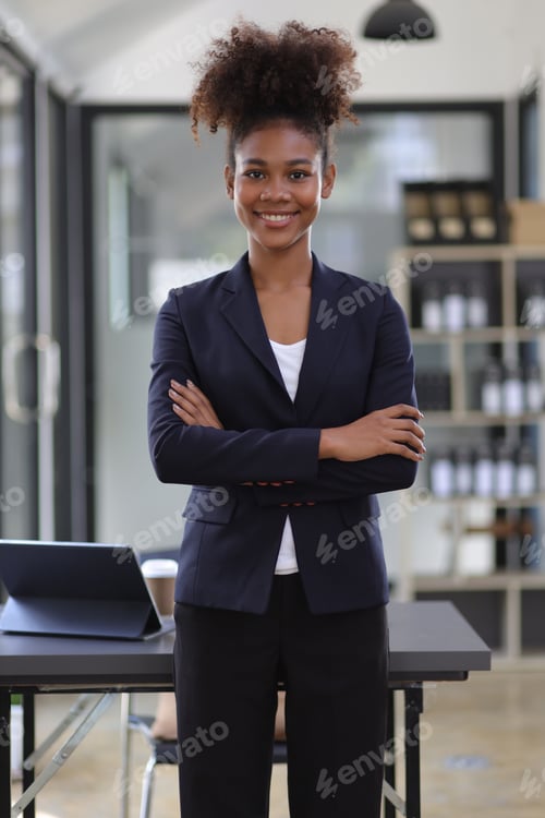 Preview: Portrait of attractive african american businesswoman working in office.