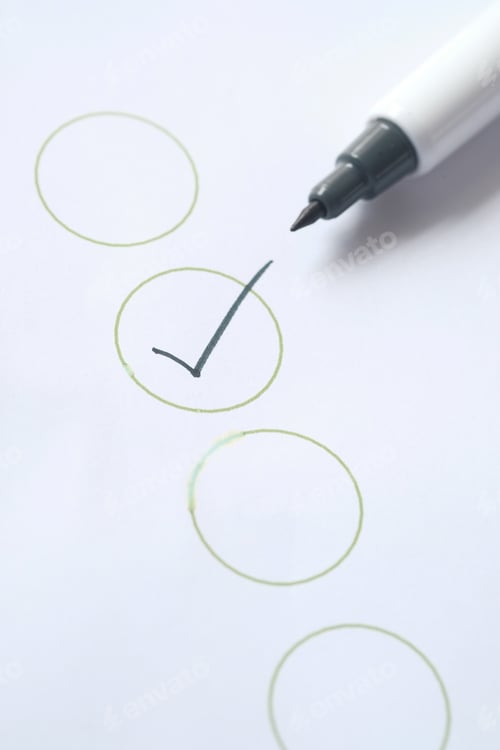 Preview: Check list with black pen on paper.