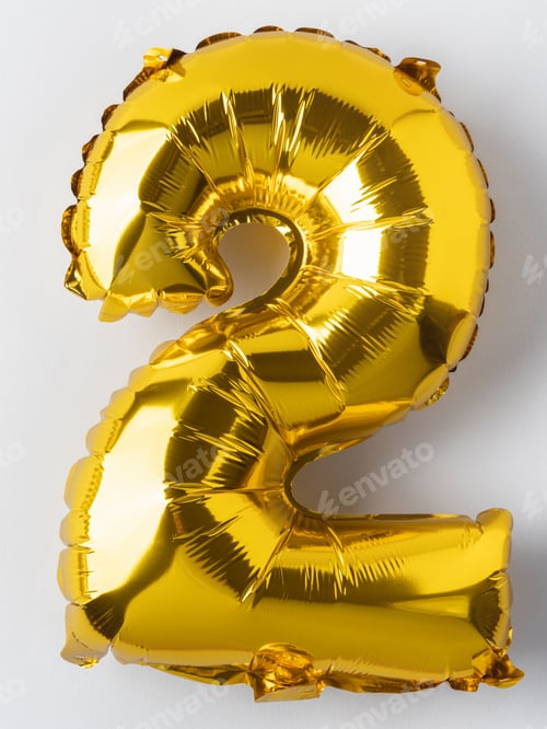 Preview: Number 2 golden foil balloon party decor on gray background, birthday anniversary concept