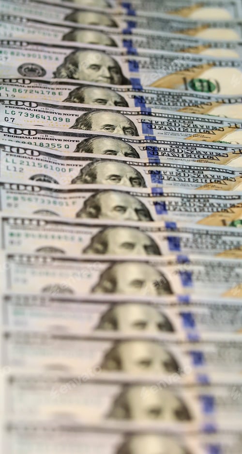 Preview: Stacks of One Hundred Dollar Bills in Soft Focus