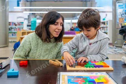 Preview: Adult and child learning together with educational puzzle
