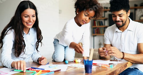 Preview: Mother and father drawing together with their child