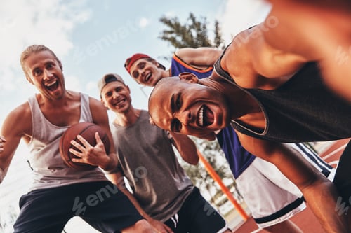 Preview: Funny selfie! Self portrait of young men in sports clothing smiling while standing outdoors