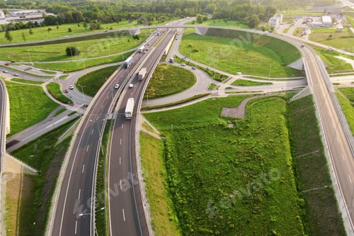 Preview: Cars moving on transport road junction in city, aerial view