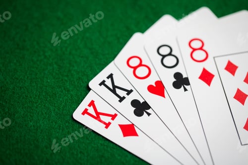 Preview: poker hand of playing cards on green casino cloth