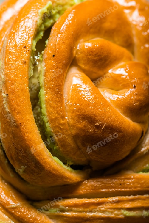 Preview: homemade buns with cream and pistachio cream decorated with thyme freshly baked for breakfast