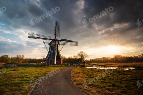 Preview: sunrise behind beautiful windmill