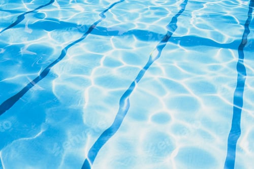 Preview: Ripple Water in swimming pool with sun reflection. Summer day at swimming pool.