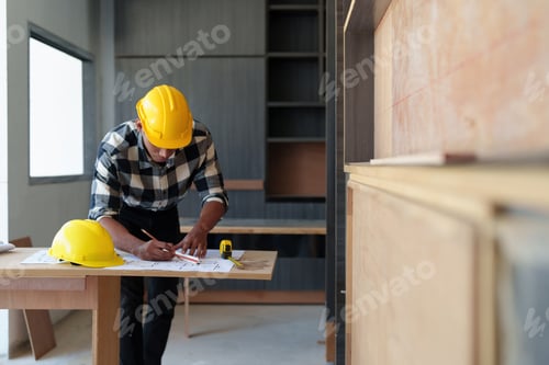 Preview: Architect man working with blueprints for architectural plan, engineer sketching a construction