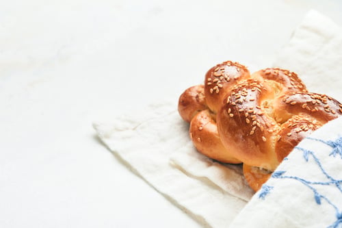 Preview: Challah bread. Sabbath kiddush ceremony composition. Freshly baked homemade braided challah bread fo