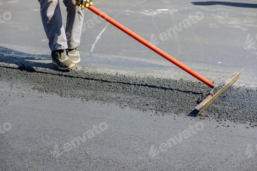 Preview: Construction workers laying new asphalt roads in the middle of the process of asphalting