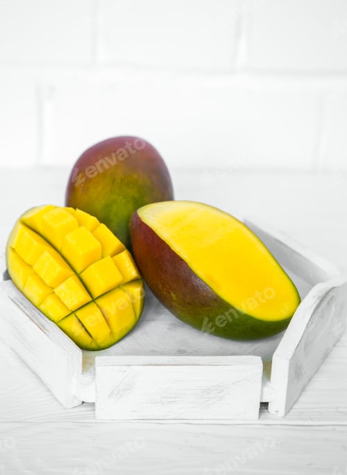 Preview: Mango on white wooden background