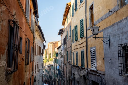 Preview: View on narrow and cozy street in Siena, Italy
