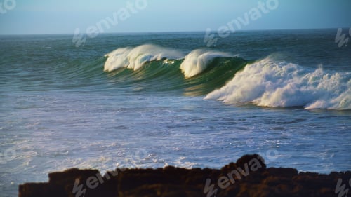 Preview: Huge ocean wave rolling in slow motion. Scenic foaming sea swelling on sunny day
