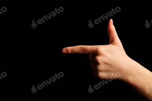 Preview: Hand Showing Sign of T Alphabet in American Sign Language (ASL), isolated on black background