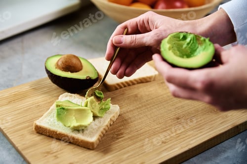 Preview: Ripe avocado in woman hands, Healthy breakfast