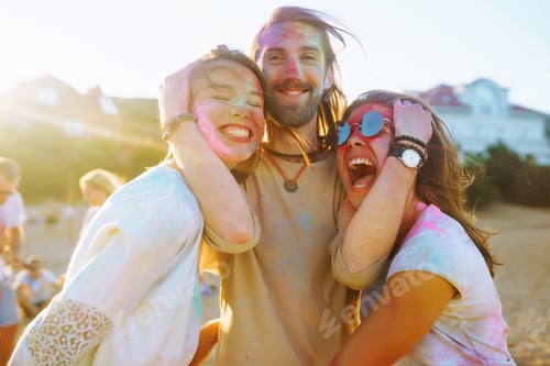 Preview: Teenagers Friends have fun at holi festival. Beach Party. Celebrating traditional spring holiday.