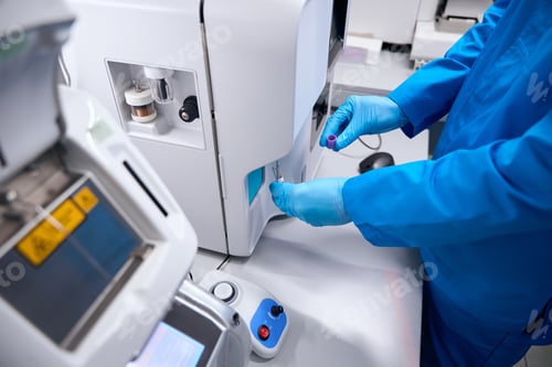 Preview: Man in uniform works on apparatus for automatic isolation of nucleic acids