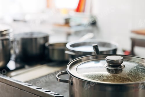 Preview: close-up shot of sauce pans at restaurant kitchen