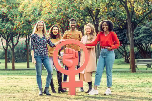 Preview: Five Adults Standing Around a Large Symbol