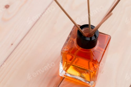 Preview: Elegant glass diffuser with aromatic oil on wooden surface