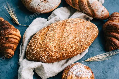 Preview: Different types of fresh bread and bakery on the table.