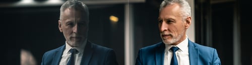 Preview: The handsome businessman standing indoor.