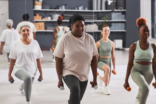 Preview: Women exercising with dumbbells in gym