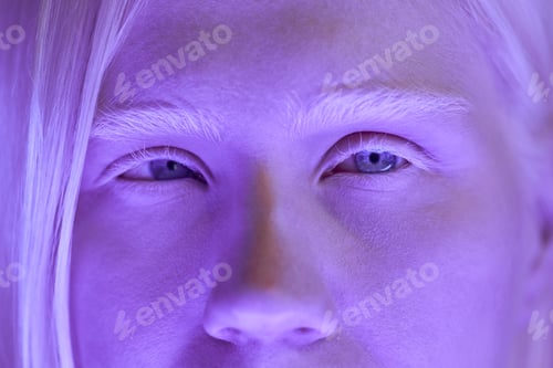 Preview: Woman with Albinism in Ultraviolet Neon Light
