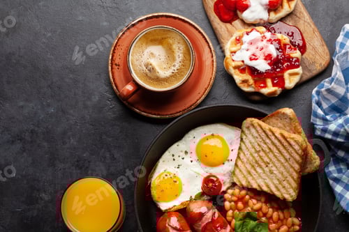 Preview: English breakfast with fried eggs, beans, bacon and sausages