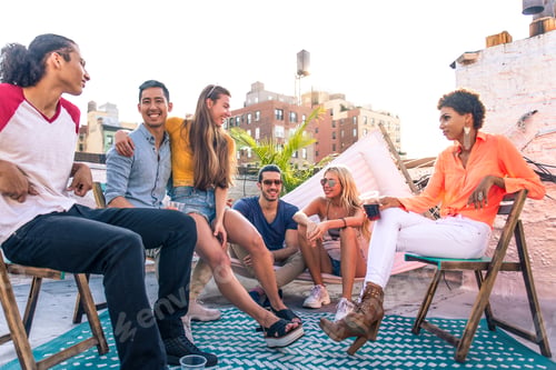 Preview: Group of friends having party on a rooftop