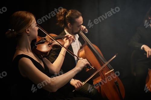Preview: String Ensemble Playing Classical Music in Dark Studio