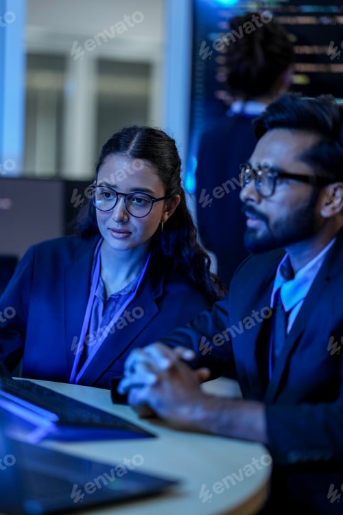 Preview: diverse team of AI developers collaborates on a night coding session.