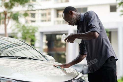 Preview: Man Removing Bug Stains Off Hood