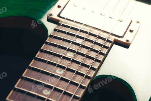 Preview: Electric guitar body and neck detail on wooden background