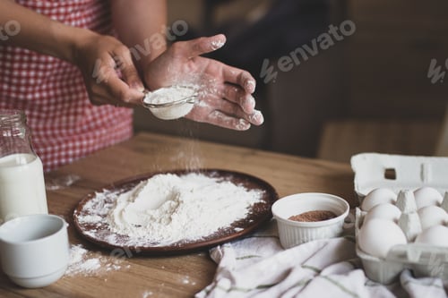 Preview: Baking process. Ingredients for baking at home. Homemade baking. Pastry chef's hands.