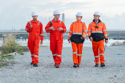 Preview: Engineering Team Walking Along Coastal Worksite