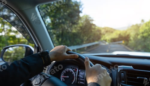 Preview: People driving car on mountain road