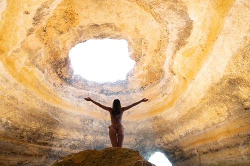 Preview: Unrecognizable woman standing in Benagil cave