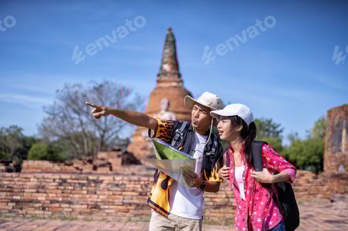 Preview: Traveler tourist man and women with backpack walking in historical place temple Ayuttaya Thailand