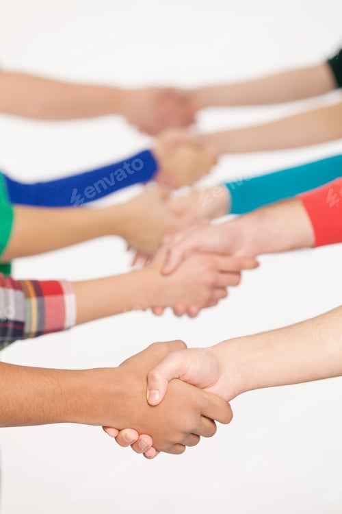 Preview: Shaking hands. Close up of people handshaking while standing in a row