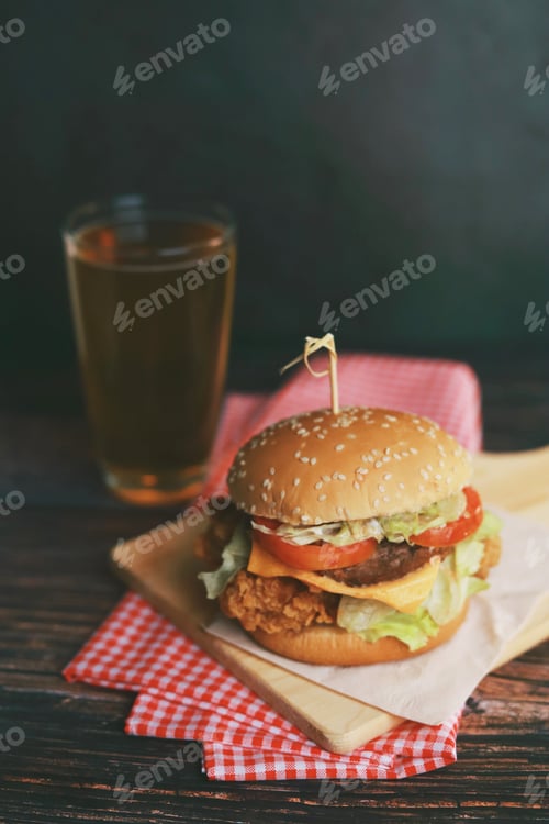 Preview: Delicious homemade beef burger on wooden table.
