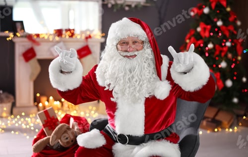 Preview: Authentic Santa Claus showing funny gestures indoors