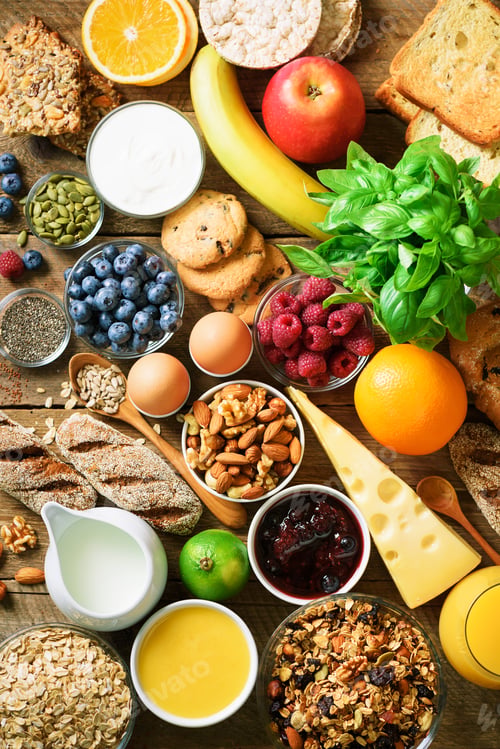Vista previa: Healthy breakfast ingredients, food frame. Granola, egg, nuts, fruits, berries, toast, milk, yogurt