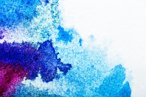 Preview: top view of blue and pink watercolor spills on white paper with copy space