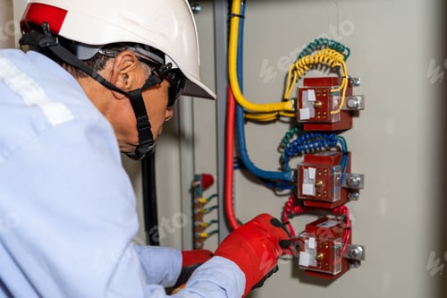 Preview: Latin electrical engineer performs maintenance on an industrial circuit