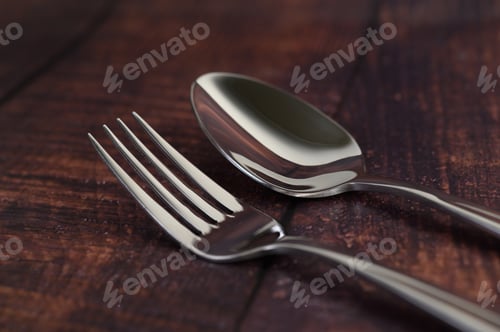 Preview: Stainless fork and spoon on wooden table